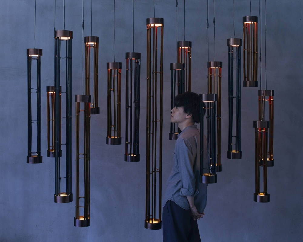 Yu Watanabe’s “urushi” Japanese lacquer pendant lamps feature in the Isola Design Festival’s “Disclosure: Design Studios Unveiled” exhibition. 
