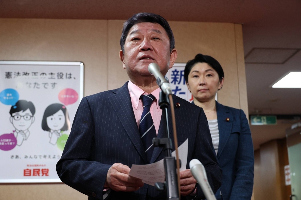 LDP Secretary-General Toshimitsu Motegi and election strategy committee chair Yuko Obuchi speak to reporters in Tokyo on April 2.