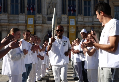 A acting torch bearer participates in a torch relay test in Troyes, France, on March 22. 