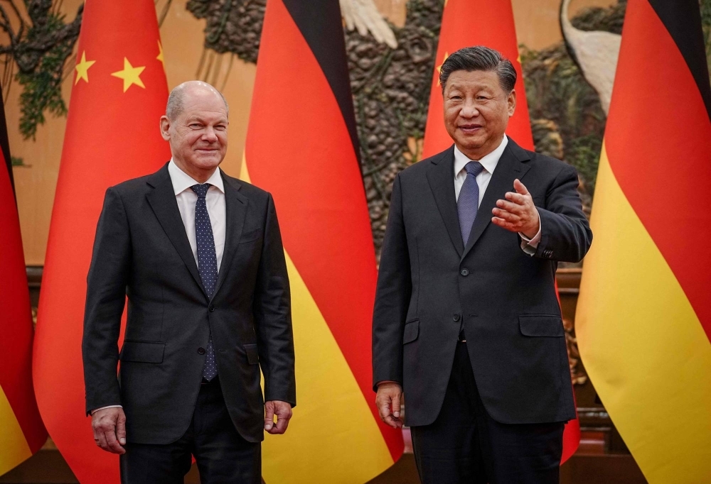 German Chancellor Olaf Scholz (left) with Chinese leader Xi Jinping in Beijing in November 2022. Scholz is travelling to China again this week with the goal of shoring up economic ties with Germany's biggest trading partner.