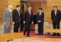 Prime Minister Fumio Kishida and Foreign Minister Yoko Kamikawa at a Cabinet meeting in Tokyo in March. | JIJI