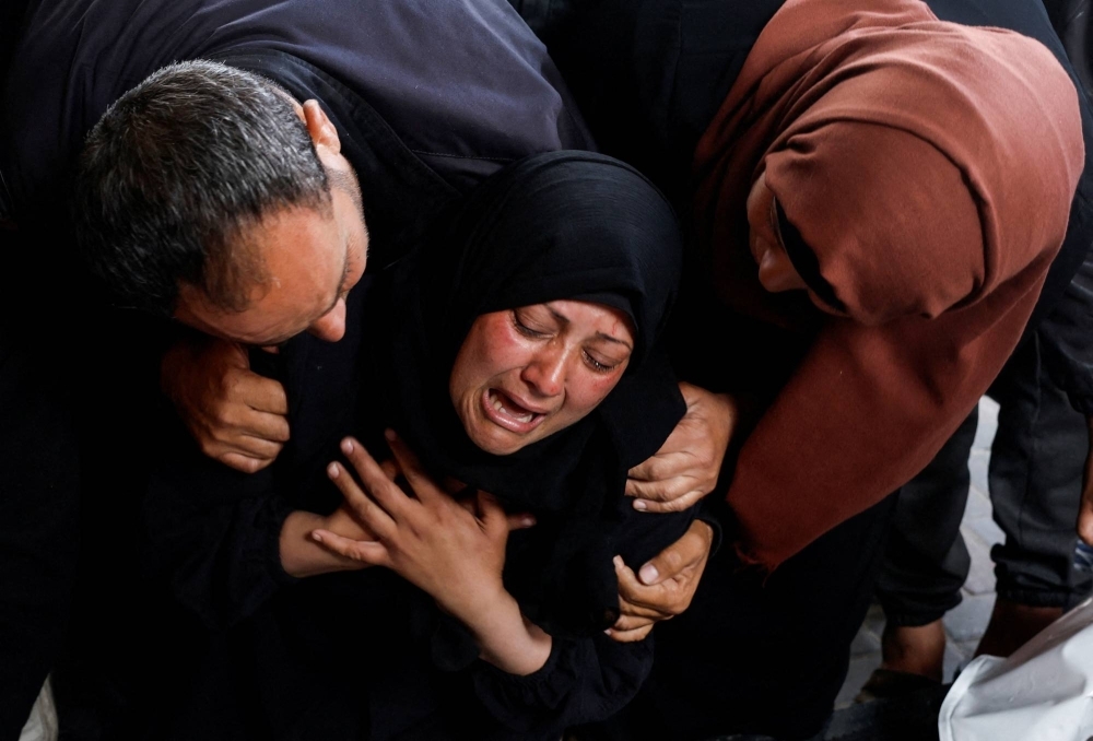 A woman grieves for Palestinians killed in Israeli strikes, amid the ongoing conflict between Israel and the Palestinian Islamist group Hamas, in Rafah, in the southern Gaza Strip, on Tuesday.