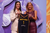 Caitlin Clark poses with WNBA Commissioner Cathy Engelbert after she was selected with the No. 1 pick by the Indiana Fever on Monday in New York.  | USA Today / via Reuters 