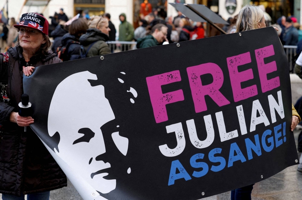 Supporters of WikiLeaks founder Julian Assange protest on the day he appeals in a British court against his extradition to the United States, in Vienna, Austria, on Feb. 20.