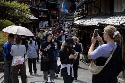 Tourists in Kyoto on Saturday. Japan saw a record 3.08 million foreign visitors in March. 