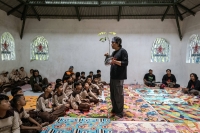 Aak Abdullah Al-Kudus, an environmentalist in East Java Province, discusses tree planting at an elementary school in Lumajang, East Java, Indonesia, in December 2023. A fatwa was issued against Aak after he tried to combine a tree-planting campaign with celebration of the Prophet Muhammad’s birthday. | Ulet Ifansasti / The New York Times