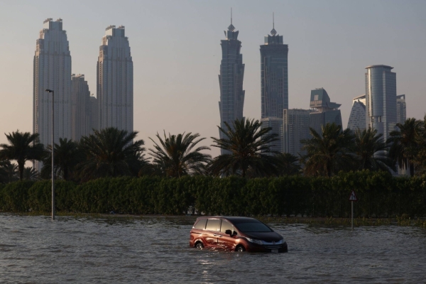 An abandoned vehicle on a flooded highway after a rainstorm in Dubai, United Arab Emirates, on Wednesday. The UAE had its largest rainfall event in 75 years on Tuesday, the government said on social media. 