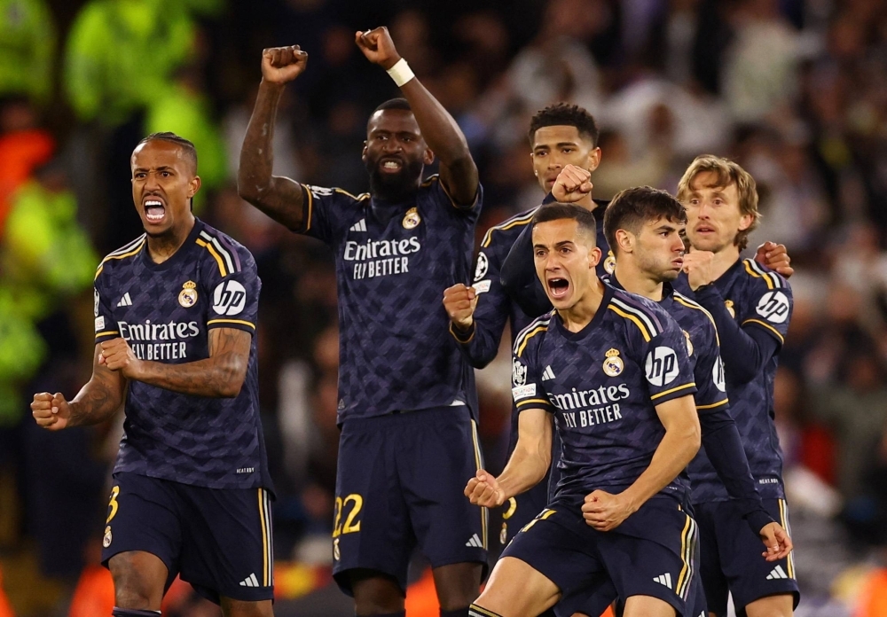 Real Madrid players celebrate during a penalty shootout against Manchester City on Wednesday. 