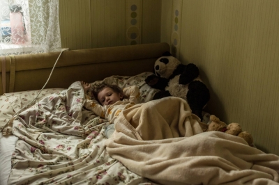 Lizi Haidarzhy, whose mother and 4-month-old brother, Tymofii, were killed in a Russian drone attack, wakes up from a nap in Odesa, Ukraine.