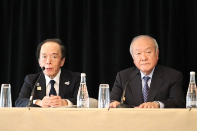 Bank of Japan Gov. Kazuo Ueda speaks at a news conference in Washington on Thursday alongside Finance Minister Shunichi Suzuki.