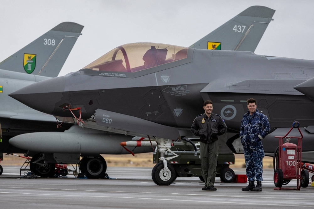 Australian Air Force pilots stand next to an F35A aircraft during a military exercise between the United States, Britain and Australia, in Nevada, in January.