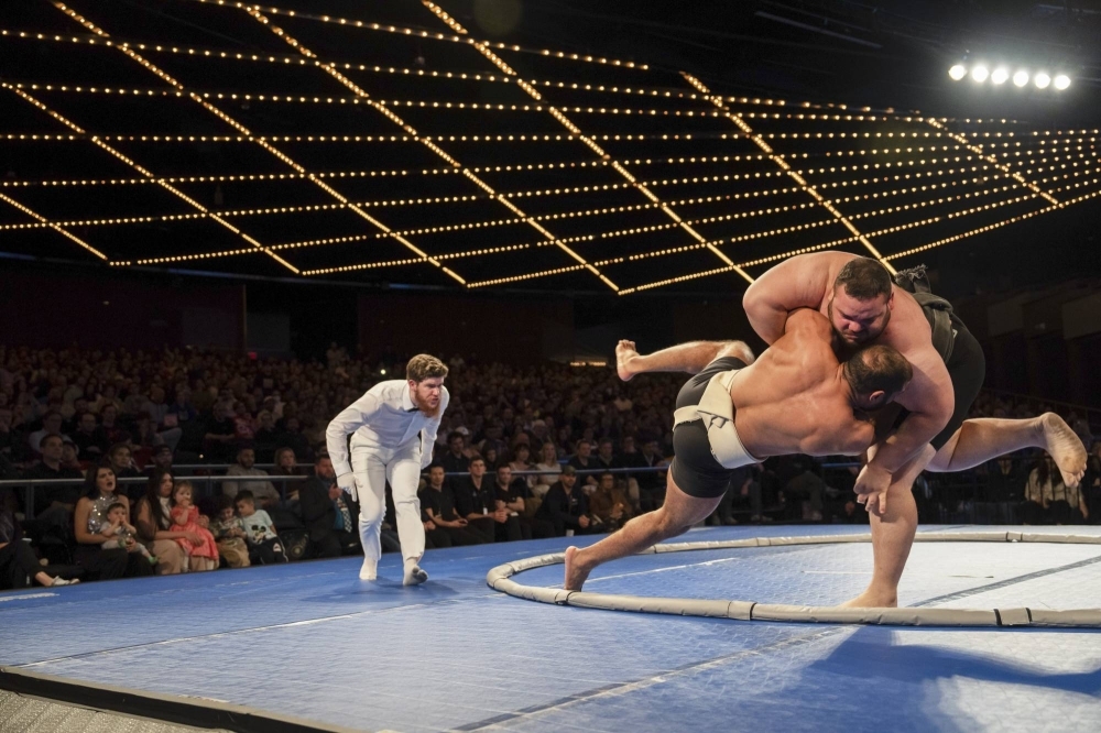 Rui "The Hurricane" Junior (right) takes down Mohamed Kamal during the World Championship Sumo tournament at Madison Square Garden in New York on April 13.