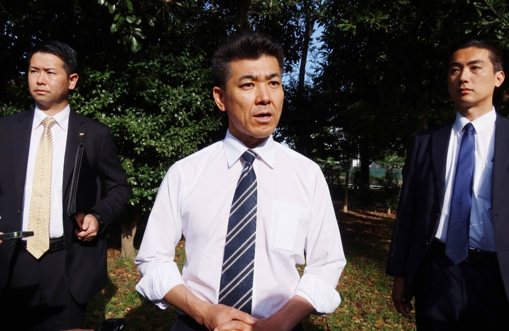CDP head Kenta Izumi speaks to reporters in Tokyo on April 13.