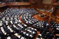 A bill to tackle the low birthrate is passed at a Lower House plenary session on Friday. | Jiji