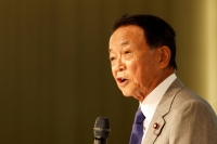 Former Prime Minister Taro Aso speaks during a forum in Taiwan in 2023.  | Reuters