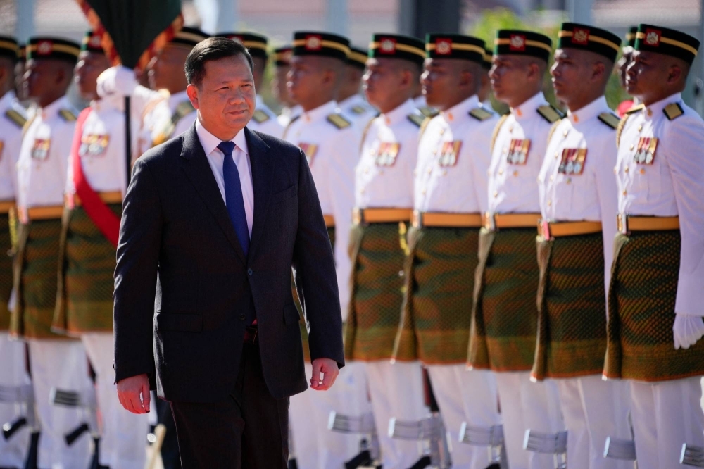 Cambodian Prime Minister Hun Manet inspects an honor guard during a welcoming ceremony in Putrajaya, Malaysia, in late February.