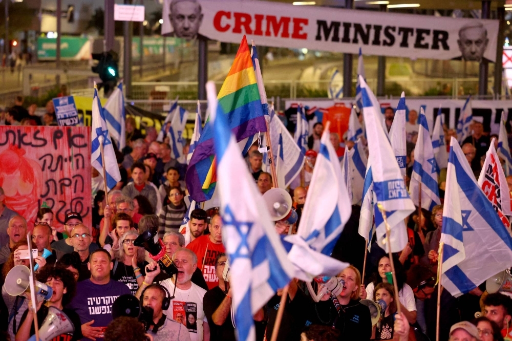 People attend a protest against Israeli Prime Minister Benjamin Netanyahu's government and to call for the release of hostages kidnapped in the deadly Oct. 7 attack on Israel by the Palestinian Islamist group Hamas, in Tel Aviv on Saturday.