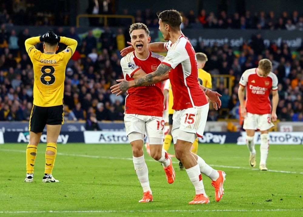 Arsenal's Leandro Trossard (left) celebrates scoring the team's first goal against Wolves on Saturday