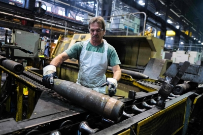 An employee handles 155 mm-caliber shells after the manufacturing process at the Scranton Army Ammunition Plant in Scranton, Pennsylvania, on April 16.