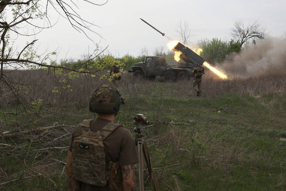 Ukrainian gunners from the 14th Separate Mechanized Brigade fire at the enemy from a position near the town of Kupyansk, in Ukraine's Kharkiv region, on Thursday.