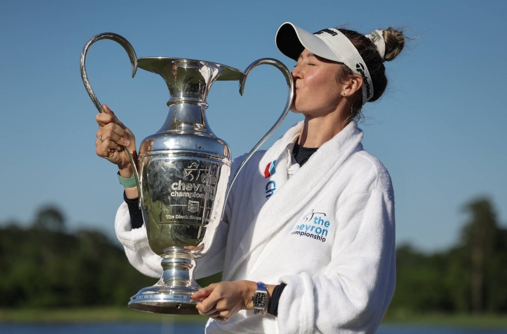 World No. 1 Nelly Korda kisses the trophy after winning The Chevron Championship in The Woodlands, Texas, on Sunday.