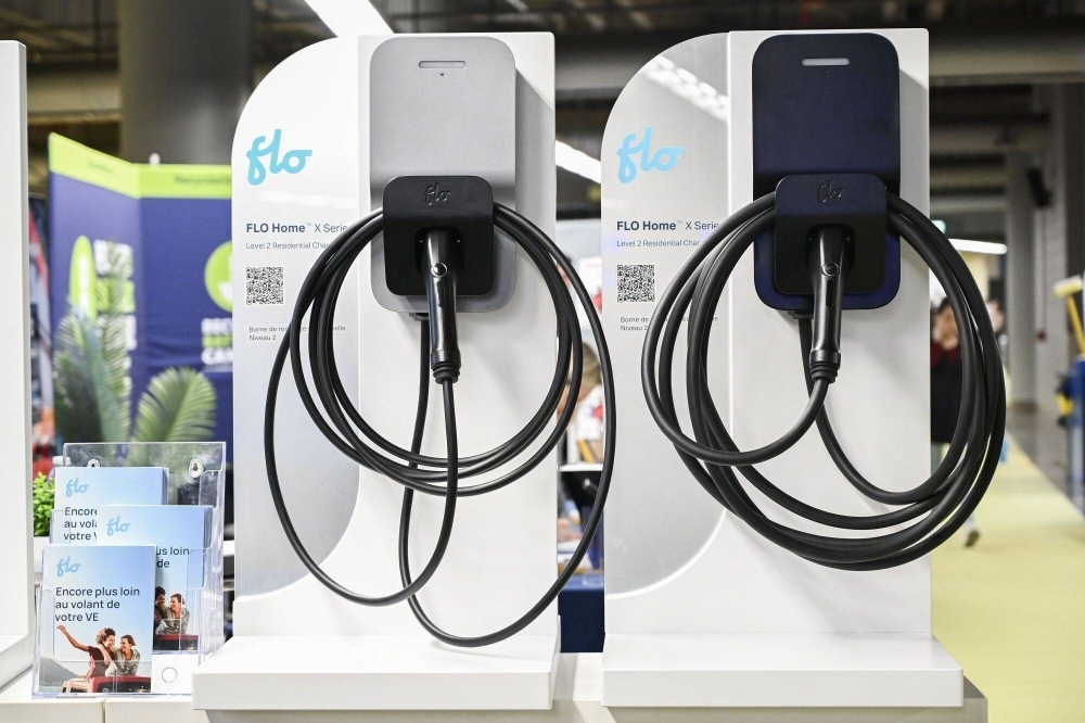 Home electric vehicle chargers during the Montreal Electric Vehicle Show in Quebec, Canada, on Friday. Prime Minister Justin Trudeau is offering more tax breaks to automotive firms to put their electric vehicle factories in Canada.