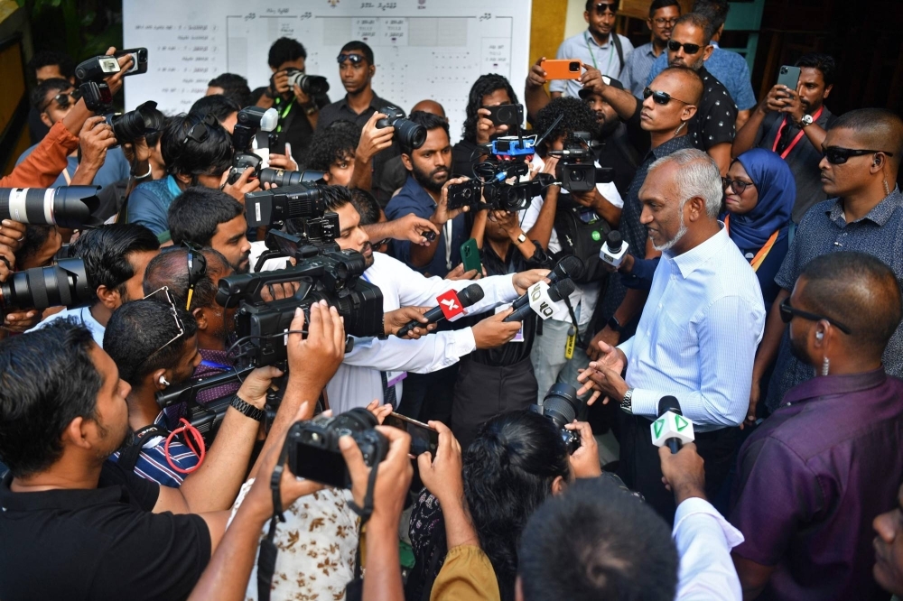 Maldives President Mohamed Muizzu addresses the media after casting his ballot during the country's parliamentary election, in Male on Sunday.