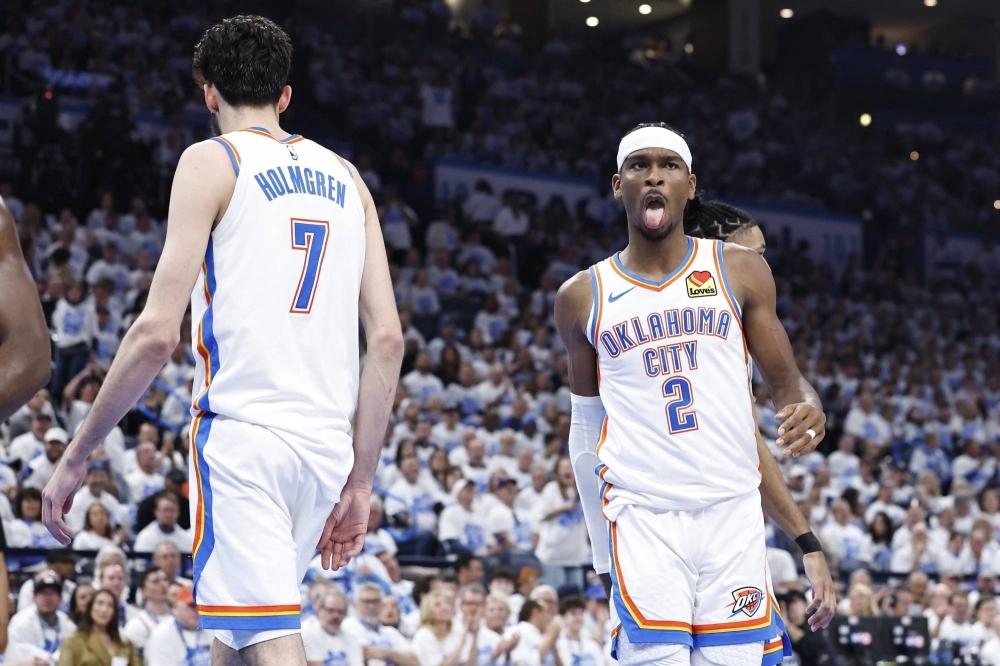 Shai Gilgeous-Alexander (right) reacts after a play during the Thunder's win over the Pelicans in Game 1 of their Western Conference playoff series in Oklahoma City, Oklahoma, on Sunday.