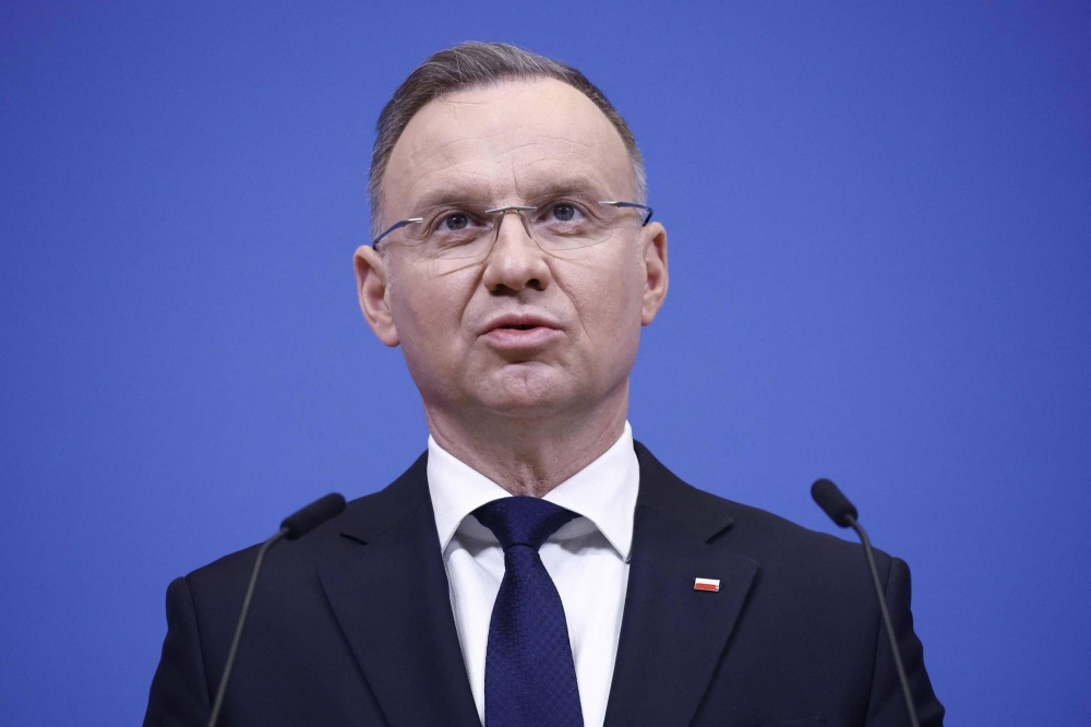 Polish President Andrzej Duda speaks during a news conference at the NATO headquarters in Brussels on March 14. 