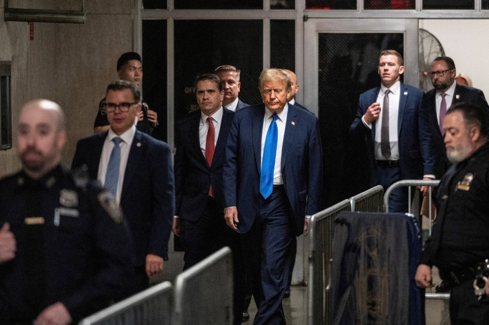 Former U.S. president and Republican presidential candidate Donald Trump arrives to court on the first day of opening statements in his trial in New York on Monday.