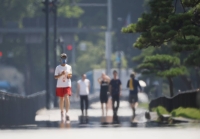 Tokyo observed the first "extremely hot day" of the season on July 10, 2023, when the temperature hit 36.5 degrees. A new heatstroke alert system will be put in place on Wednesday. | Jiji