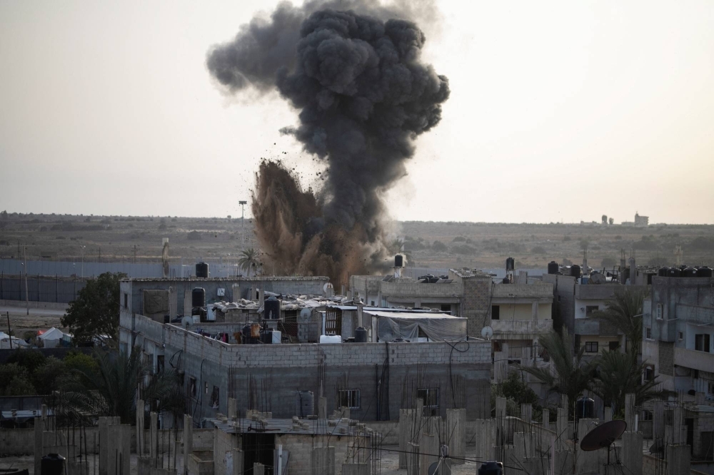 Smoke rises following Israeli strikes in Rafah, in the southern Gaza Strip, on Monday.