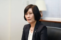 Mitsuko Tottori, CEO of Japan Airlines, takes part in a media briefing in Tokyo on Wednesday. | Bloomberg