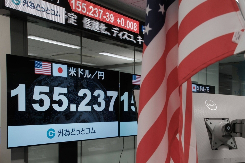 The rate of the yen against the U.S. dollar is displayed in the trading room at foreign exchange brokerage Gaitame.com in Tokyo on Thursday.
