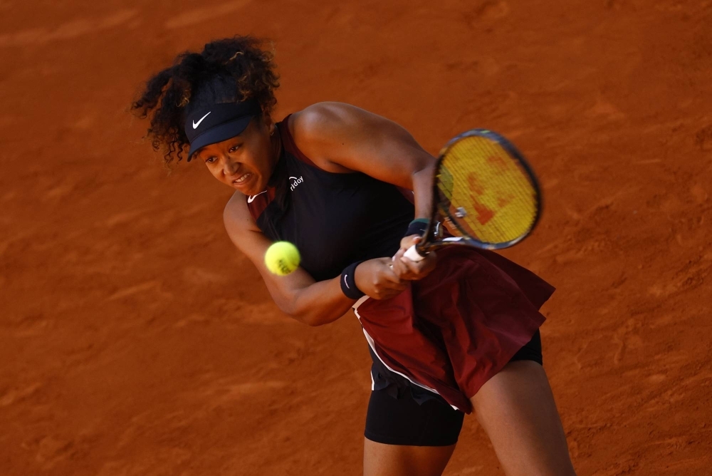 Naomi Osaka hits a shot against Greet Minnen during the first round of the Madrid Open on Wednesday. 