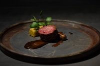 One of chef Ikemi’s signature dishes is his "ballotine" of Gin no Kamo duck, a specialty of Aomori Prefecture, which he serves with Towada silk sweet potato and a black garlic sauce. | TAKAO OHTA

