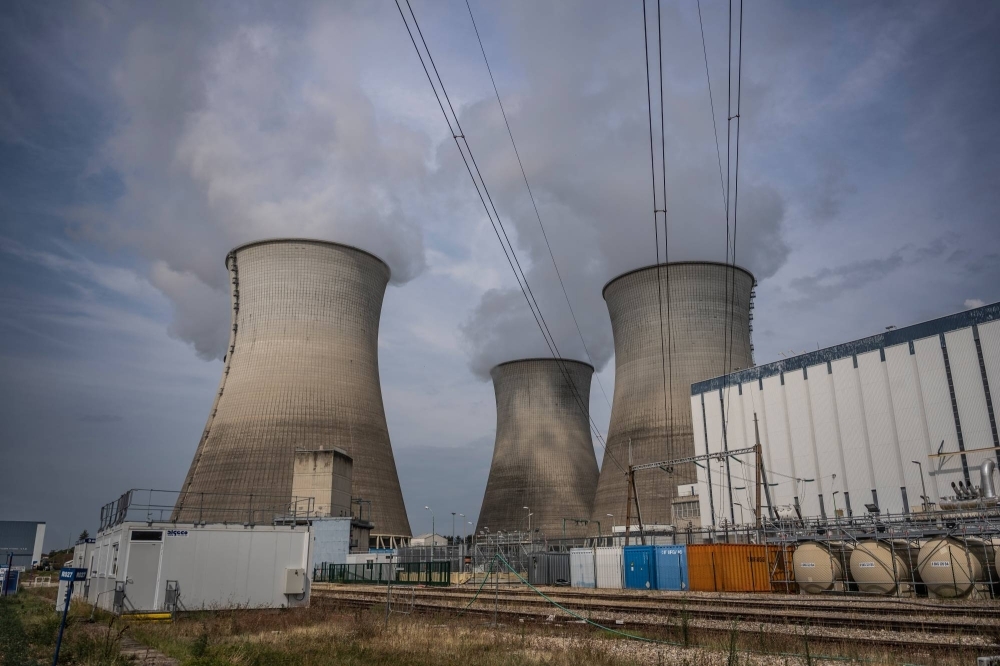 Vapor rises from cooling towers of a nuclear power station in Bugey, France. Geopolitical instability and war are putting the growth of nuclear power, a key clean energy source to combat climate change, at risk. Vapor rises from cooling towers of a nuclear power station in Bugey, France. Geopolitical instability and war are putting the growth of nuclear power, a key clean energy source to combat climate change, at risk.