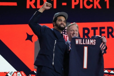 Caleb Williams poses with NFL Commissioner Roger Goodell after being selected by the Chicago Bears with the No. 1 overall pick in the NFL draft in Detroit on Thursday.