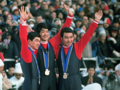 Yukio Kasaya (center), who won a ski jumping gold medal at the 1972 Sapporo Winter Olympics, stands on the podium with silver medalist Akitsugu Konno (left) and bronze medalist Seiji Aochi in Sapporo in February 1972.