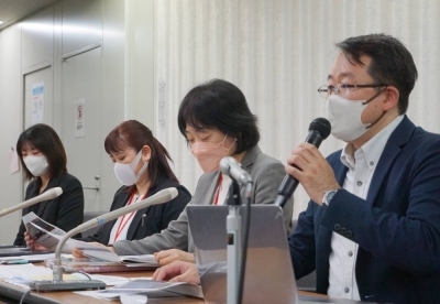 Members of a group of former second-generation Jenovah's Witnesses speak during a news conference in Tokyo in November.