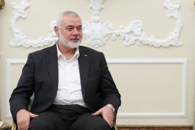 The top leader of Palestinian militant group Hamas, Ismail Haniyeh, meets with the Iranian president in Tehran on March 27.