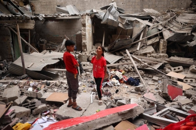 Palestinian children stand amid the debris of a house destroyed by overnight Israeli bombardment in Rafah, in the southern Gaza Strip, on Saturday.