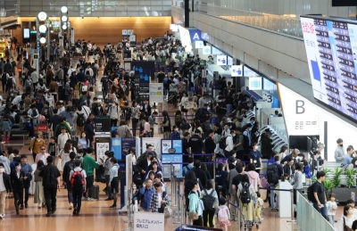 The departure lobby for domestic flights is crowded with travelers at Haneda Airport in Tokyo on Saturday, the first day of this year's Golden Week holidays.