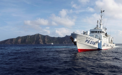 A Japan Coast Guard vessel sails near one of the disputed East China Sea islands that Japan calls the Senkakus and China calls Diaoyu, in August 2013.

 