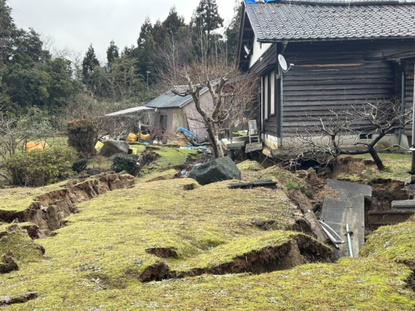 The processing plant and warehouse of Minamidani Yoshie Shoten in Wajima, Ishikawa Prefecture, are seen damaged due to cracks on the ground left behind by the New Year's Day earthquake.