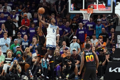 Timberwolves guard Anthony Edwards dunks against the Suns during the second half in Phoenix on Sunday.