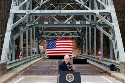 U.S. President Joe Biden makes an appearance at an infrastructure construction project in Woodstock, New Hampshire, in November 2021.  Bridges and sewage systems may seem unglamorous, but common assets such as these will form the basis of economic growth for years to come. 
