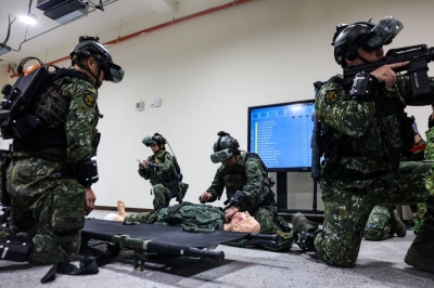 Taiwanese soldiers participate in battlefield rescue training in Taipei on Tuesday.