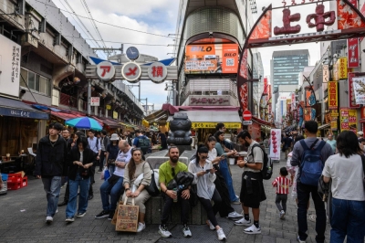 People visit the Ameya Yokocho market in Tokyo's Ueno district during the Golden Week holiday on Tuesday.