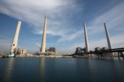 Smokestacks at an Israel Electric Corp power station are seen from the Mediterranean, about 10 kilometers from the coastal Israeli city of Hadera, in 2014.